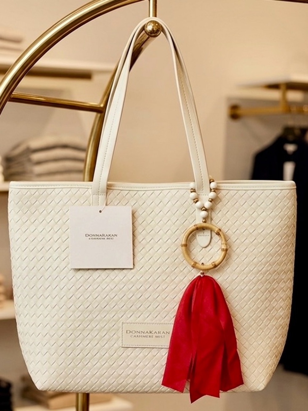 Donna Karan Cream CreamTote with Red velvet tassel, bamboo ring with bead accent